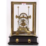 A 20th century brass skeleton clock, the enamelled chapter ring showing Roman numerals, having