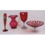 A 19th century ruby overlaid glass vase, h.30cm; together with three further pieces of cranberry