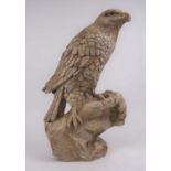 A composite model of an eagle, shown perched upon a rock, h.60cm