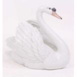 A Lladro porcelain model of a swan, h.19cm