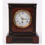A Victorian ebonised mantel clock, the enamelled dial showing Roman numerals, h.26cm