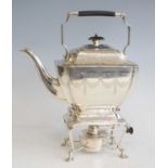 An Edwardian silver spirit kettle on stand, of rectangular form with canted corners, having all-over
