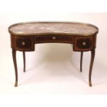 An Edwardian mahogany and crossbanded marble topped kneehole dressing table, of kidney shape, having