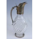A Victorian silver mounted and cut glass claret jug, the glass body of flattened globular form