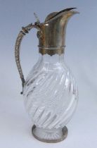 A Victorian silver mounted and cut glass claret jug, the glass body of flattened globular form