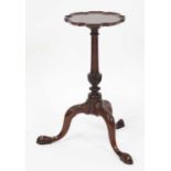 A circa 1900 mahogany kettle stand, the fixed top having a piecrust edge, the whole raised on a