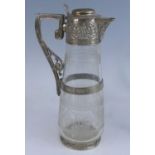 A Victorian silver mounted and cut glass claret jug, the glass body of low baluster form with
