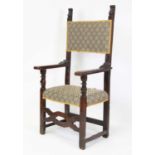 A late 17th century Spanish walnut framed armchair, of joined construction, having pad back and