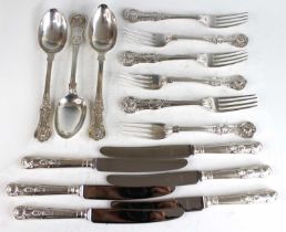 A set of six Victorian silver table forks in the Queens pattern, and three matching serving