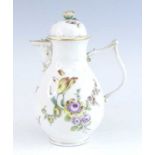 A Meissen porcelain coffee pot, circa 1750, of baluster form, having a flower finial and tau handle,