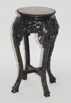 A Chinese rosewood and marble inset jardiniere stand, the pierced frieze carved with prunus blossom,