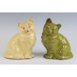 A near pair of Ewenny pottery models of cats, circa 1900, each shown in seated pose and sgraffito