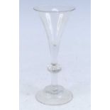 A wine glass, circa 1750, the drawn trumpet bowl above a knopped stem and domed foot, h.18cm