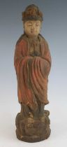 A carved softwood and polychrome painted figure of the Bodhisattva Guanyin, carved in standing