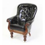 A William IV mahogany framed and polished deep black leather upholstered buttonback library