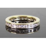 A yellow and white metal diamond full eternity ring, comprising 30 round brilliant cut diamonds in