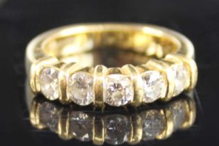 An 18ct yellow gold diamond half eternity ring, featuring five round brilliant cut diamonds in bar