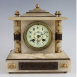 A late Victorian alabaster and champleve enamel inlaid mantel clock, having a circular white