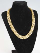 An 18ct yellow gold Byzantine link collar, with box clasp and figure-of-eight safety catch, length