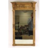 A late 19th century giltwood and gesso pier glass, having a moulded frieze, the plain mirrorplate