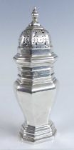 A George V silver sugar sifter, of octagonal baluster form to a stepped footrim, the removable cover