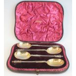 A cased set of four Victorian silver apostle spoons, having Apostle cast terminals upon spiral-