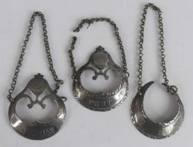 Three 18th century silver decanter labels, of neo-classical crescent moon form with engraved