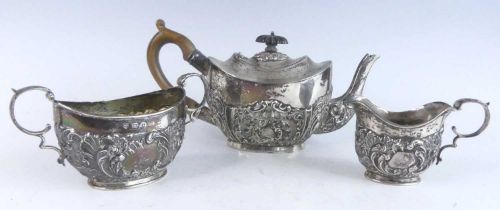 A late Victorian three-piece bachelors tea set, comprising teapot, twin handled sugar and cream,