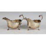 A pair of silver sauceboats in the mid-18th century style, each having acanthus leaf capped flying