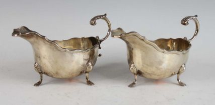 A pair of silver sauceboats in the mid-18th century style, each having acanthus leaf capped flying