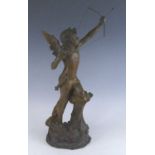 An Austrian pottery model of Cupid, early 20th century, shown leant on a stump with bow raised,