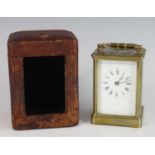 A late 19th century French lacquered brass carriage clock, having an unsigned white Roman dial,