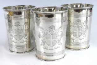 A set of three early Victorian silver beakers, each of cylindrical slightly tapering form with