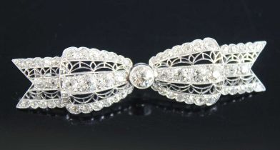 A white metal Art Deco bow brooch, featuring 61 Old European cut diamonds in grain and bezel