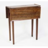 A George III mahogany rent table, having a central flush brass carry handle, the top having fall