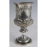 A Victorian silver presentation pedestal goblet, of campagna form to a lipped stem and spreading