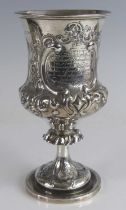 A Victorian silver presentation pedestal goblet, of campagna form to a lipped stem and spreading