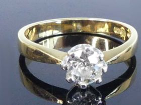 An 18ct yellow and white gold diamond solitaire ring, featuring an Old European cut diamond in an