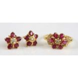 A yellow metal ruby and diamond ring and earring set, the ring designed as a circular cluster with