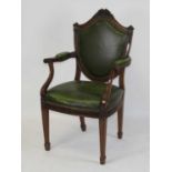 An Empire style mahogany framed oversize elbow chair, early 20th century, having a shield shaped