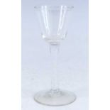 A wine glass, circa 1770, the round funnel bowl above a multi series opaque twist stem, h.16cm