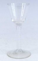 A wine glass, circa 1770, the round funnel bowl above a multi series opaque twist stem, h.16cm