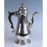 An early George III silver coffee pot, of plain squat baluster form to a stepped circular footrim,