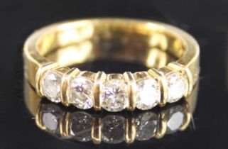 An 18ct yellow gold diamond half eternity ring, comprising five round brilliant cut diamonds in