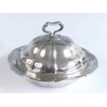 A late Victorian silver muffin dish and cover, of shaped melon form with contoured reeded rims and