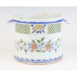 A French faience seau a bouteille, early 18th century, the cylindrical body flanked by twin handles,