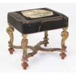 A Baroque influenced giltwood dressing stool, having a woolwork inset velvet stuffover seat, the