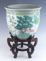 A Chinese porcelain fish bowl, Republic period, circa 1930, enamel decorated with horses before