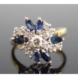 An 18ct yellow and white gold, sapphire and diamond abstract cluster ring, comprising six marquise