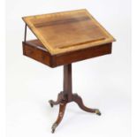 An unusual Regency rosewood and satinwood crossbanded writing table, having a hinged and crossbanded